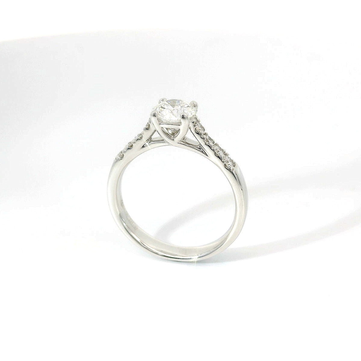 White gold solitaire with brilliant-cut diamonds on the shank, 1.08 carats.
