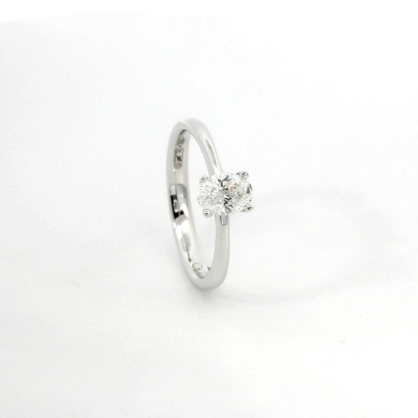 White gold solitaire with oval-cut lab-grown diamond, 0.50 carats.