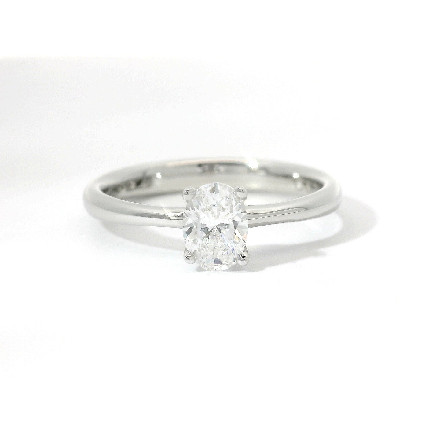 White gold solitaire with oval-cut lab-grown diamond, 0.50 carats.