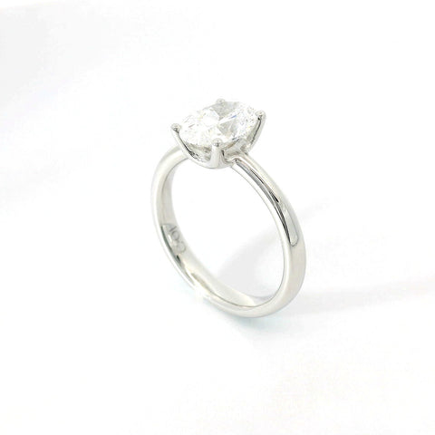 Solitaire in white gold with oval-cut lab-grown diamond, 1.54 carats.