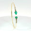 Bracciale Twin in oro giallo con smeraldi Lab-Grown taglio goccia e ovale e diamanti Lab-Grown taglio brillante.