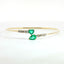 Bracciale Twin in oro giallo con smeraldi Lab-Grown e diamanti Lab-Grown taglio brillante.
