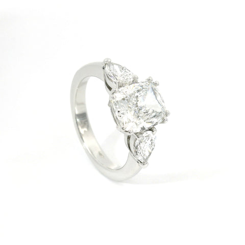 Trilogy with cushion cut lab-grown diamond and two pear cut lab-grown diamonds, 3.90 carats.