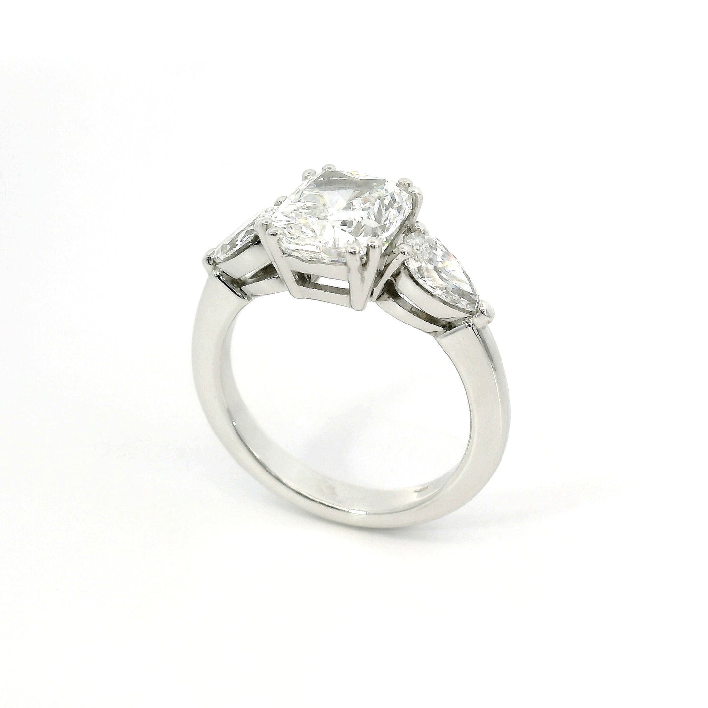 Trilogy with cushion cut lab-grown diamond and two pear cut lab-grown diamonds, 3.90 carats.