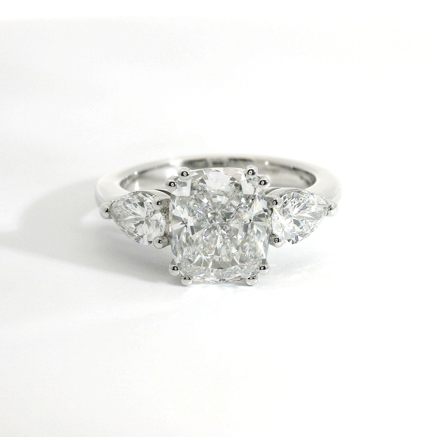 Trilogy with cushion cut lab-grown diamond and two pear cut lab-grown diamonds, 3.90 carats.