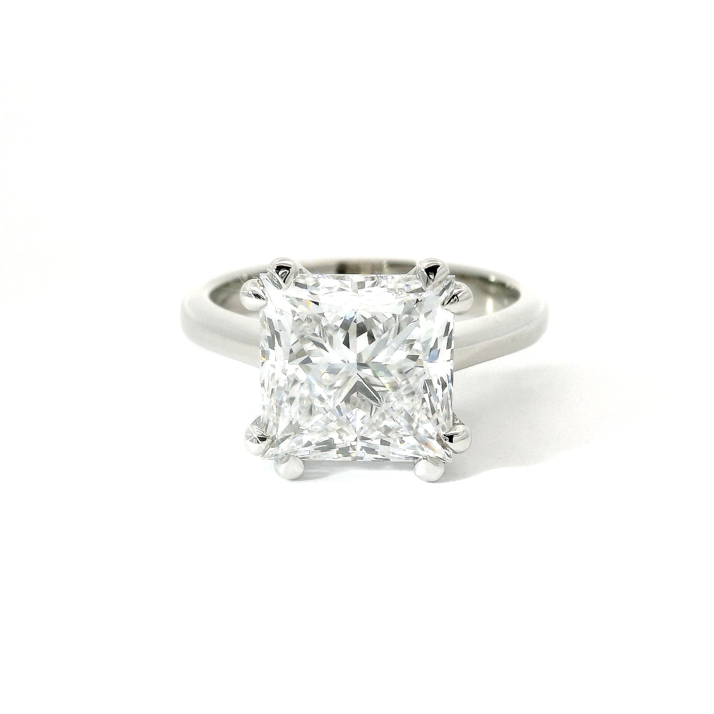 Solitaire in white gold with lab-grown princess-cut diamond, 5.18 carats.