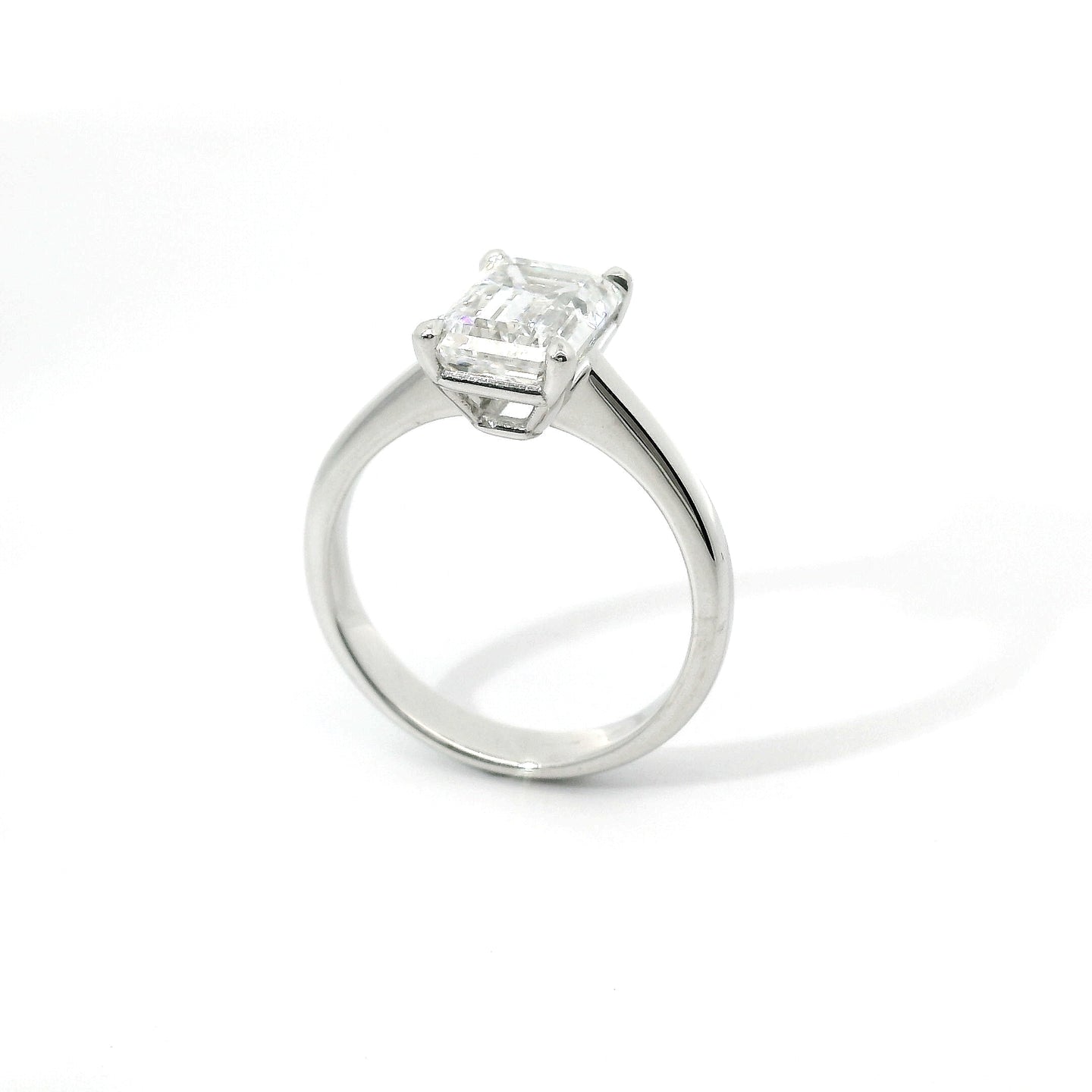 Solitaire in white gold with emerald-cut lab-grown diamond, 3.04 carats.