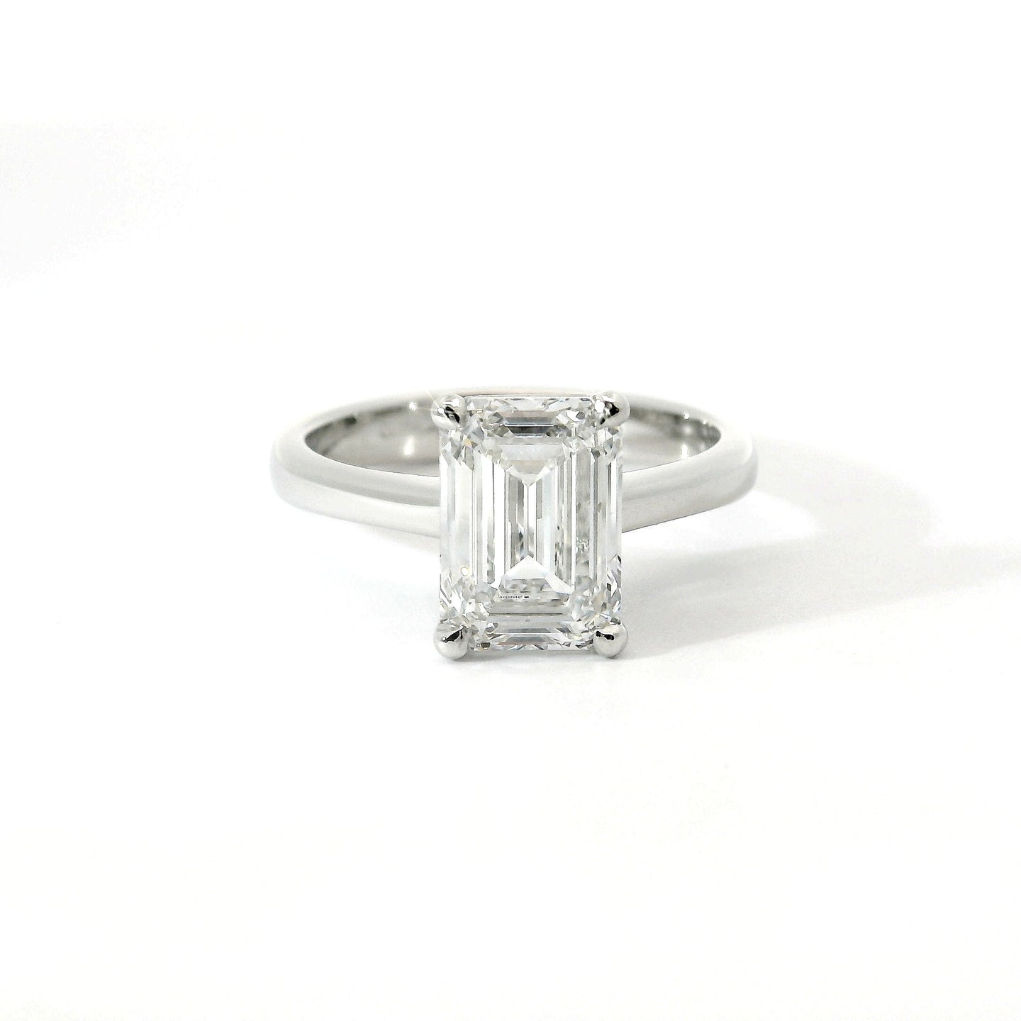 Solitaire in white gold with emerald-cut lab-grown diamond, 3.04 carats.