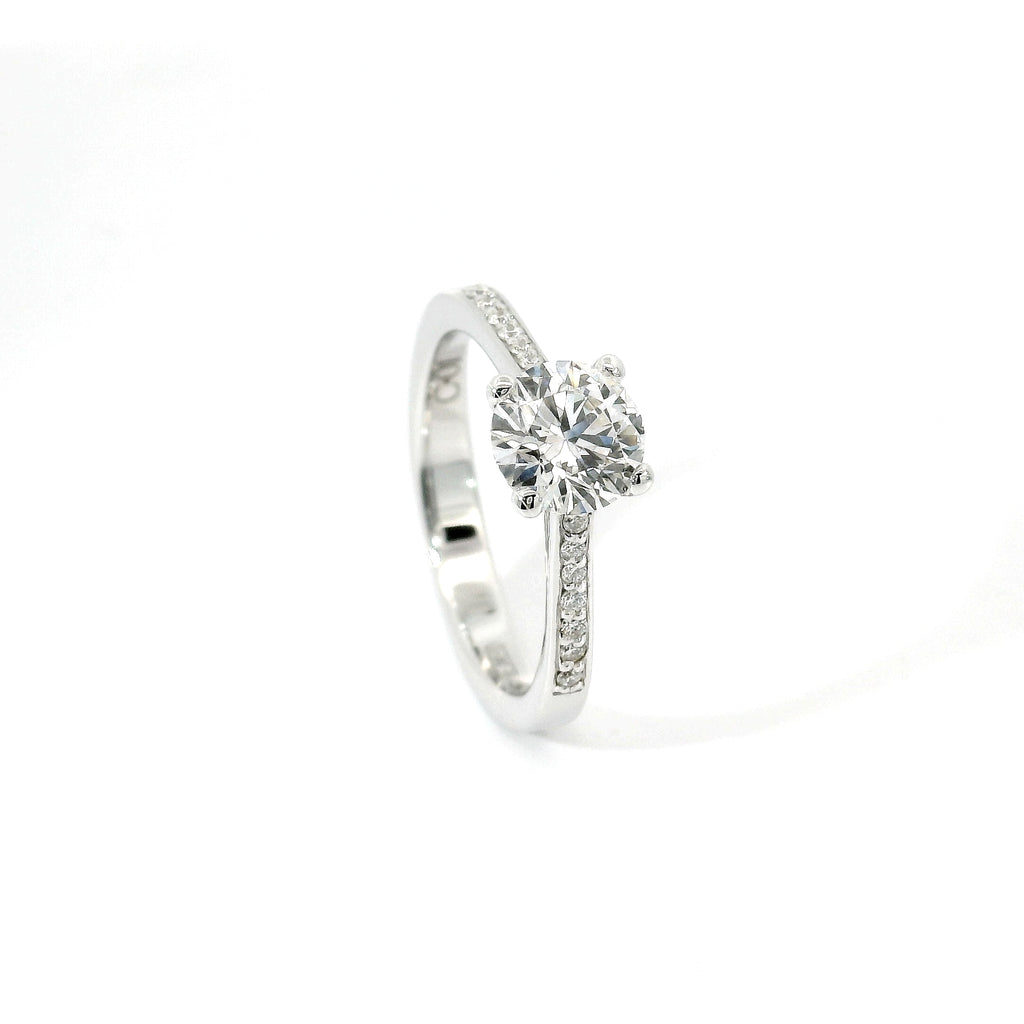 White gold solitaire with brilliant-cut diamonds on the shank, 1.08 carats.