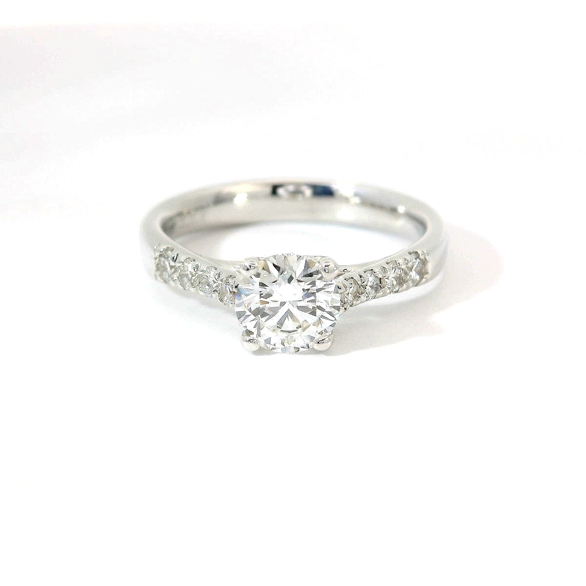 White gold solitaire with brilliant-cut diamonds on the shank, 1.08 carats.