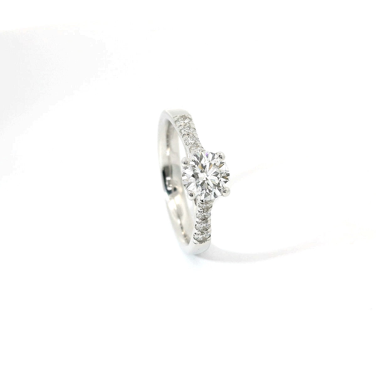 White gold solitaire with brilliant-cut diamonds on the shank, 1.08 carats.