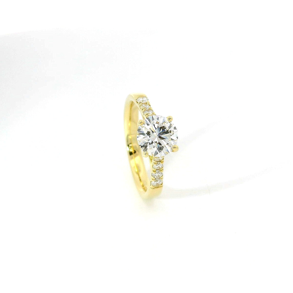 White gold solitaire with brilliant-cut diamonds on the shank, 1.08 carats.