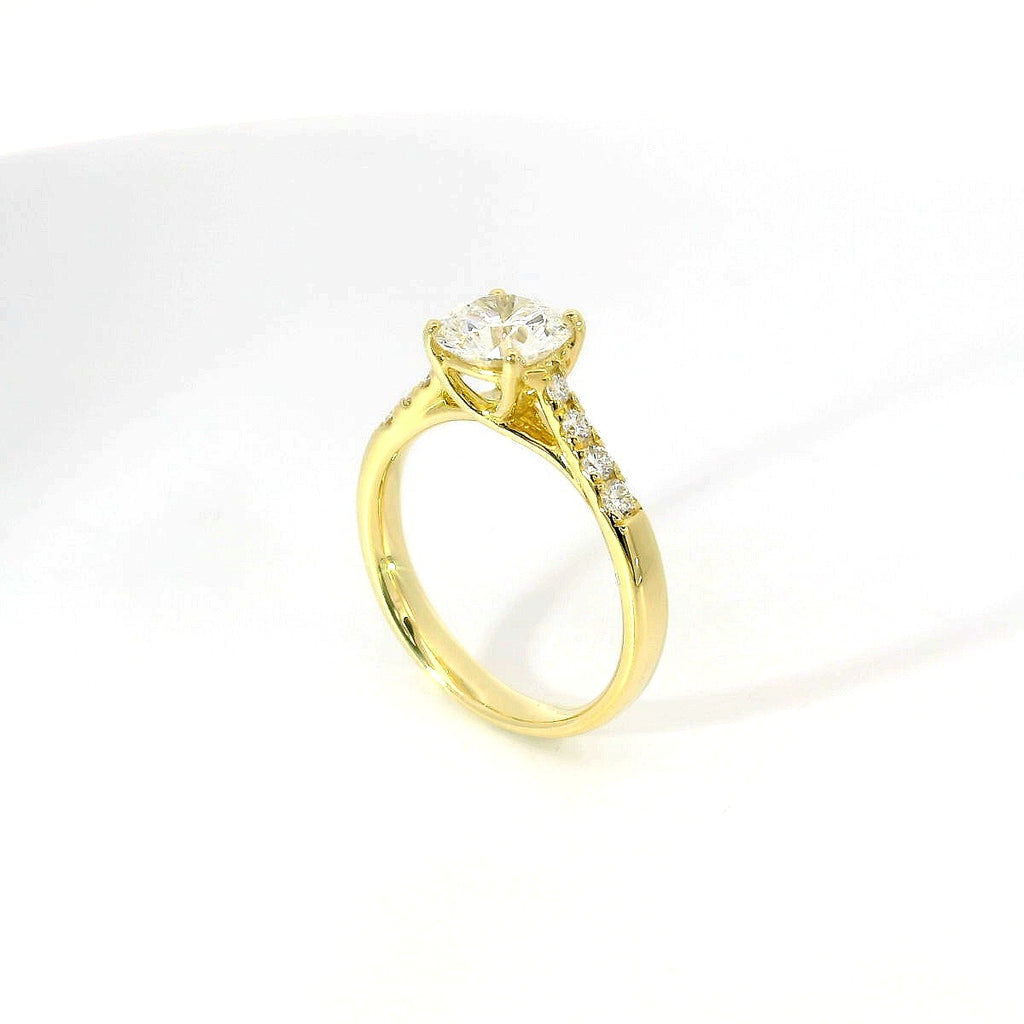 White gold solitaire with brilliant-cut diamonds on the shank, 1.08 carats.