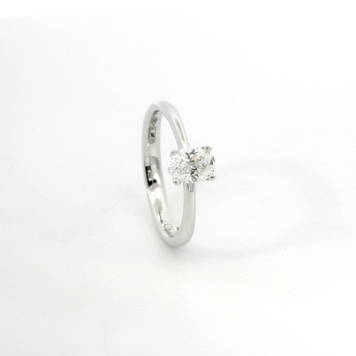 Solitaire in white gold with oval-cut lab-grown diamond, 1.54 carats.
