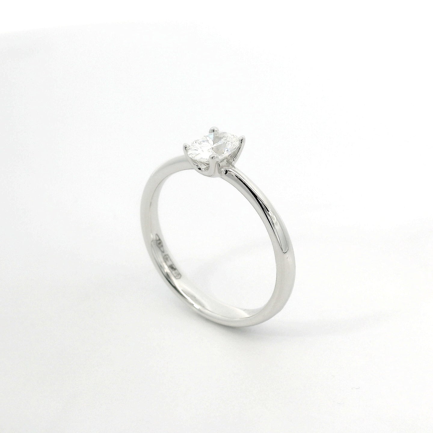 White gold solitaire with oval-cut lab-grown diamond, 0.50 carats.