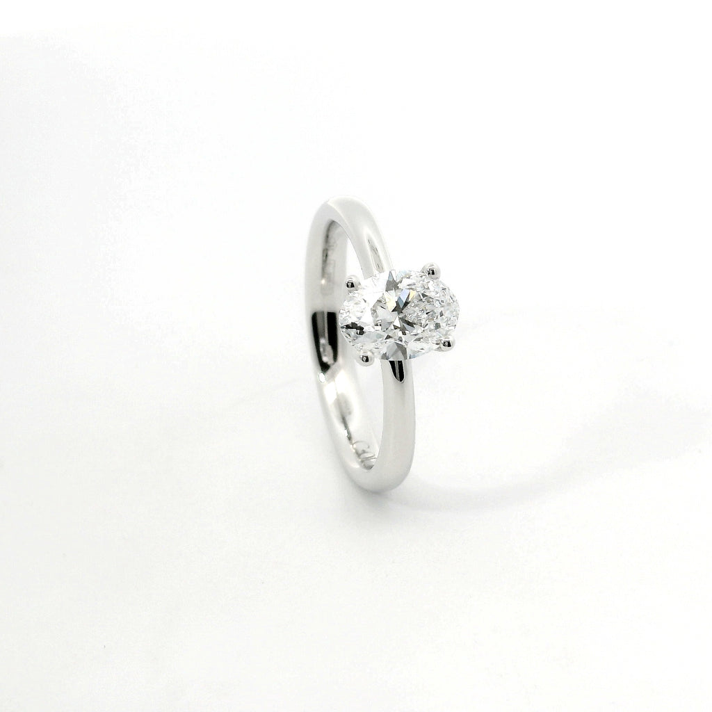 Solitaire in white gold with oval-cut lab-grown diamond, 1.54 carats.