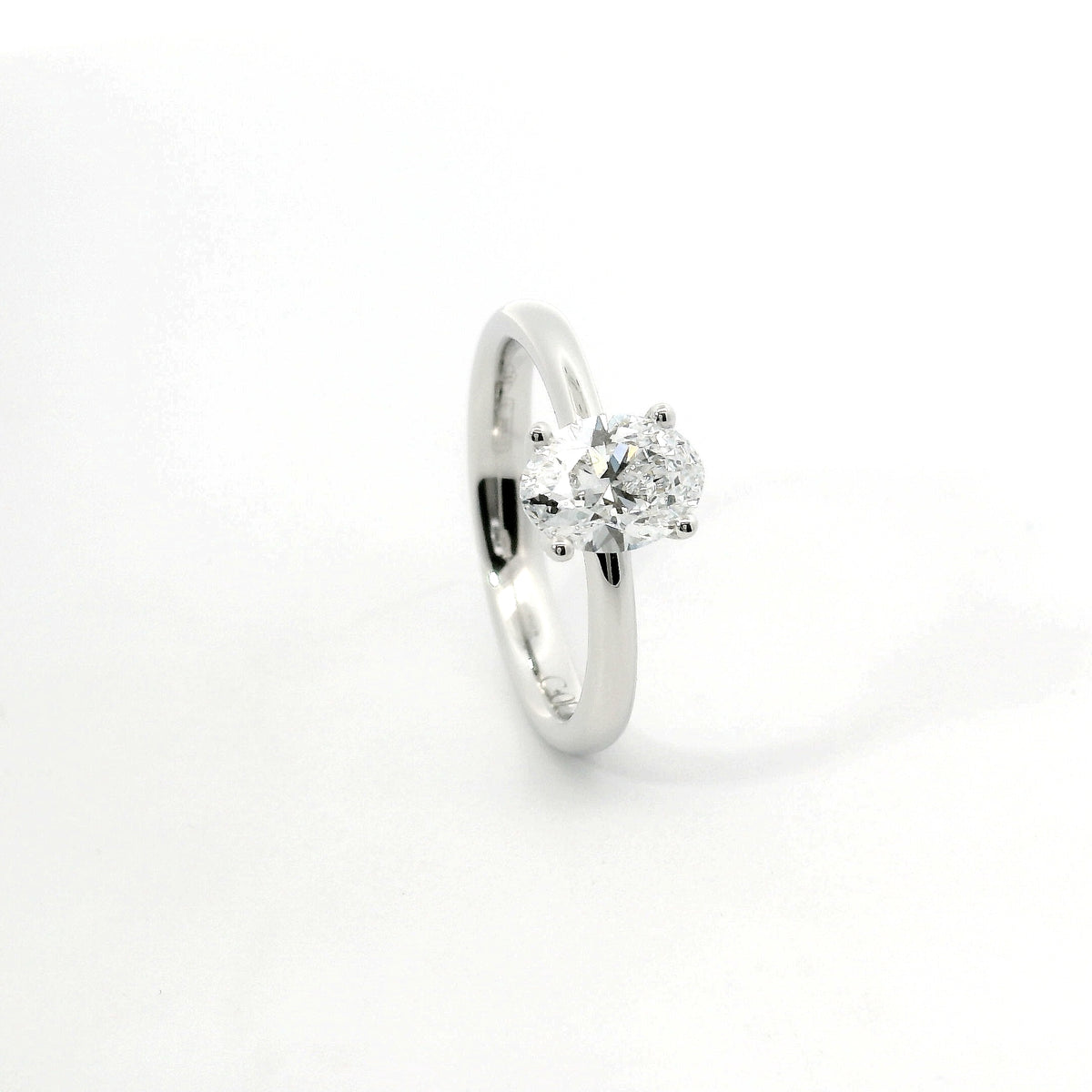 Solitaire in white gold with oval-cut lab-grown diamond, 1.54 carats.