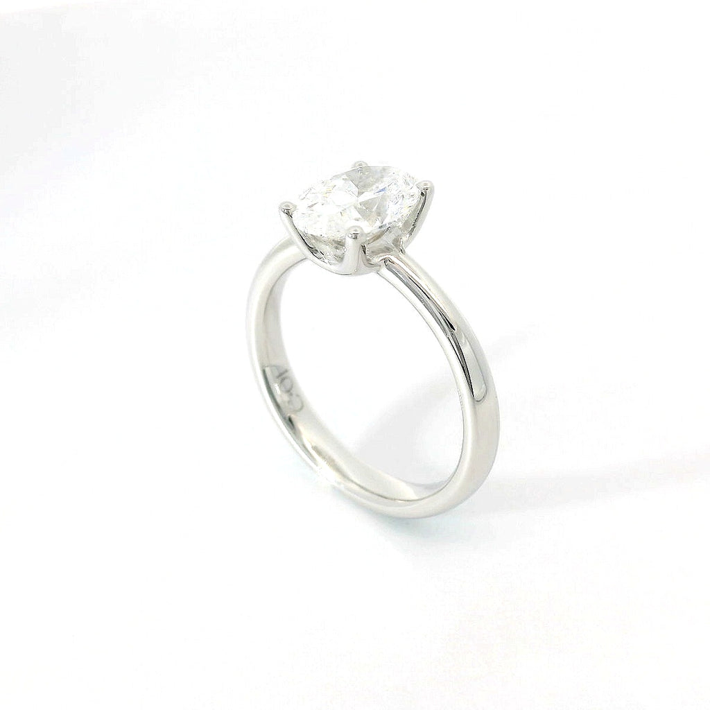 Solitaire in white gold with oval-cut lab-grown diamond, 1.54 carats.