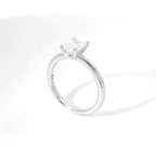 Solitaire in white gold with emerald-cut lab-grown diamond, 1.00 carats.