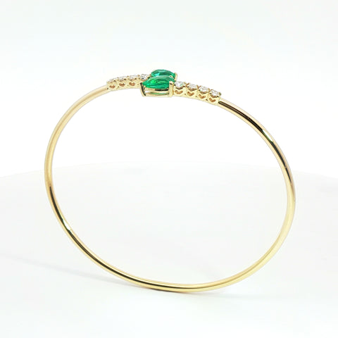 Bracciale Twin in oro giallo con smeraldi Lab-Grown e diamanti Lab-Grown taglio brillante.
