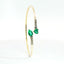 Bracciale Twin in oro giallo con smeraldi Lab-Grown e diamanti Lab-Grown taglio brillante.