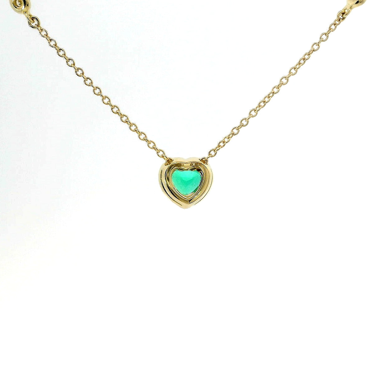 Girocollo in oro giallo con Smeraldo Lab-Grown taglio cuore e diamanti Lab-Grown taglio brillante.