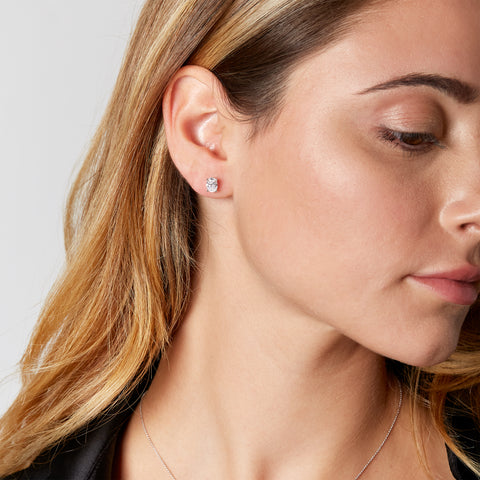 White gold stud earrings with oval-cut lab-grown diamond, 1.41 carats.
