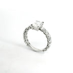 Solitaire with radiant cut lab-grown diamond and brilliant cut lab-grown diamonds on the shank, 3.81 carats.