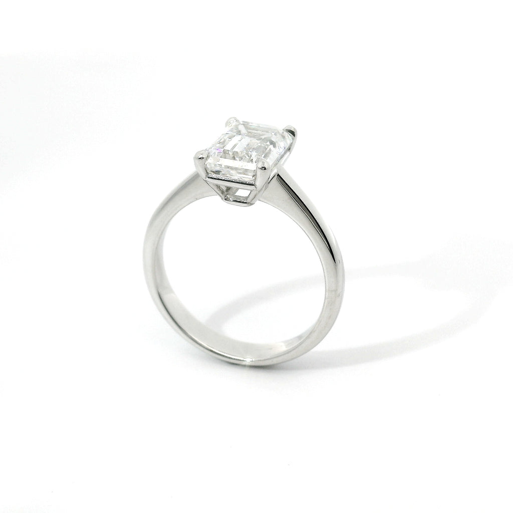 Solitaire in white gold with emerald-cut lab-grown diamond, 3.04 carats.