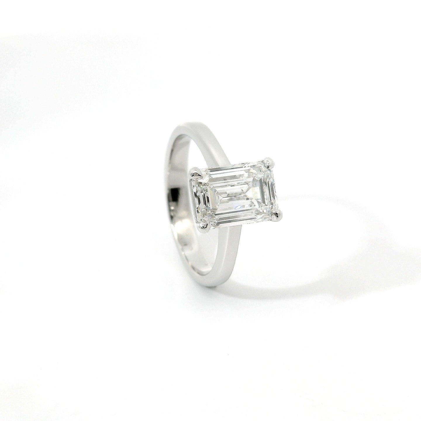 Solitaire in white gold with emerald-cut lab-grown diamond, 3.04 carats.