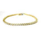 Bracciale tennis con castone a tre punte in oro giallo e diamanti lab-grown taglio brillante, 3,46 carati.