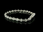 Bracciale tennis a filo in oro bianco con spot di diamanti lab-grown taglio brillante, 8,15 carati.