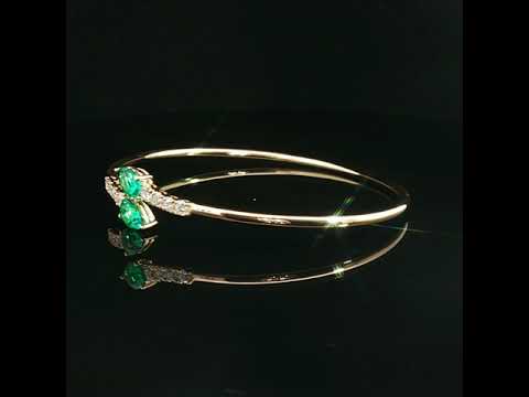 Bracciale Twin in oro giallo con smeraldi Lab-Grown taglio goccia e diamanti Lab-Grown taglio brillante.